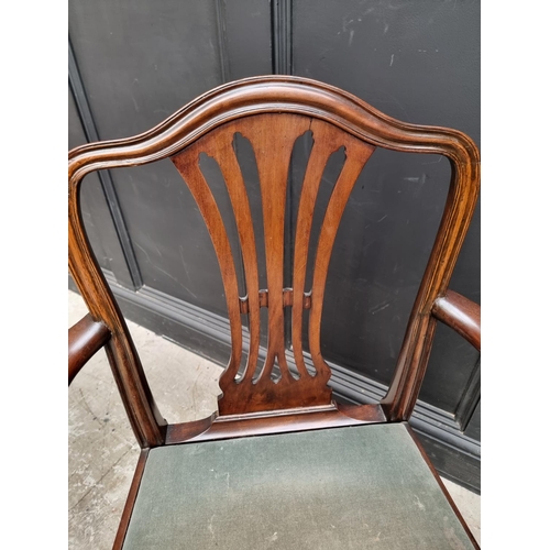 1081 - A George III mahogany elbow chair.