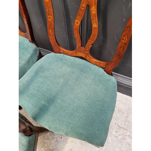 1082 - A set of three 18th century Dutch carved walnut and marquetry dining chairs. (3)