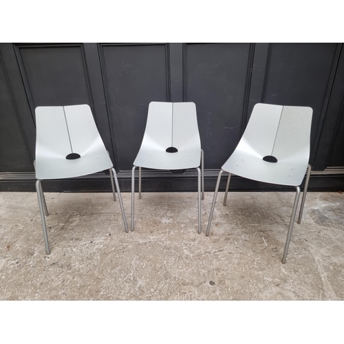 1087 - A set of three mid-century aluminium stacking chairs. 