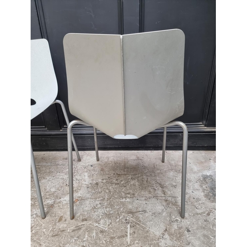 1087 - A set of three mid-century aluminium stacking chairs. 