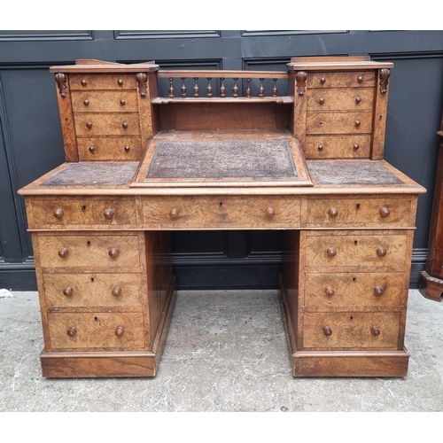 1092 - A Victorian burr walnut Dickens desk, 142.5cm wide.