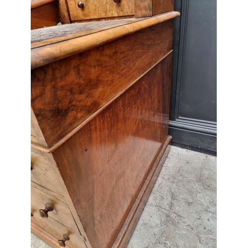 1092 - A Victorian burr walnut Dickens desk, 142.5cm wide.