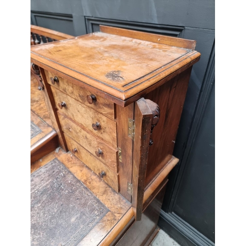 1092 - A Victorian burr walnut Dickens desk, 142.5cm wide.