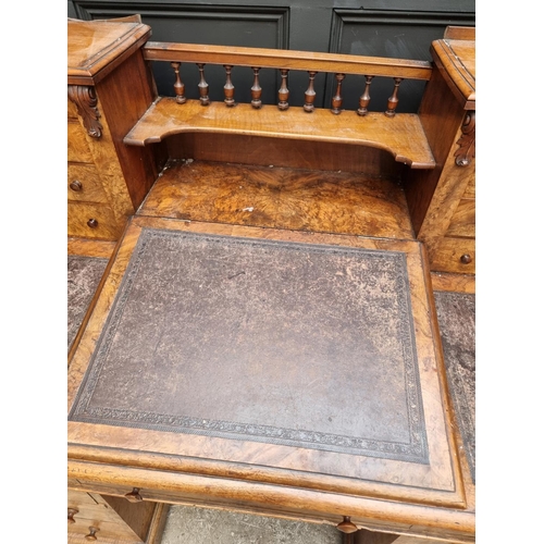 1092 - A Victorian burr walnut Dickens desk, 142.5cm wide.