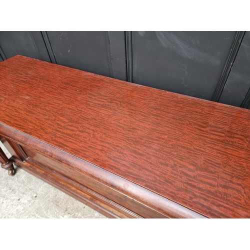 1093 - A large Victorian mahogany extending dining table and matching leaf cabinet, with four leaves, ... 