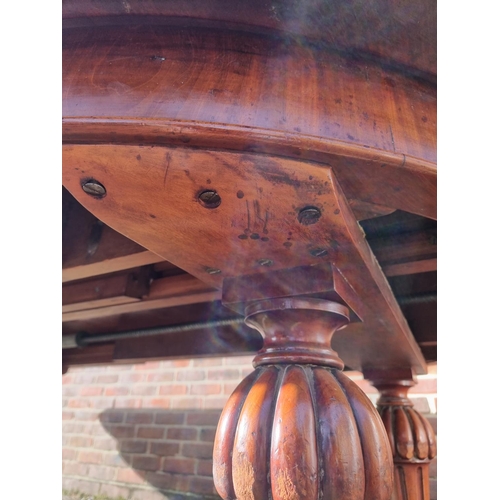 1093 - A large Victorian mahogany extending dining table and matching leaf cabinet, with four leaves, ... 