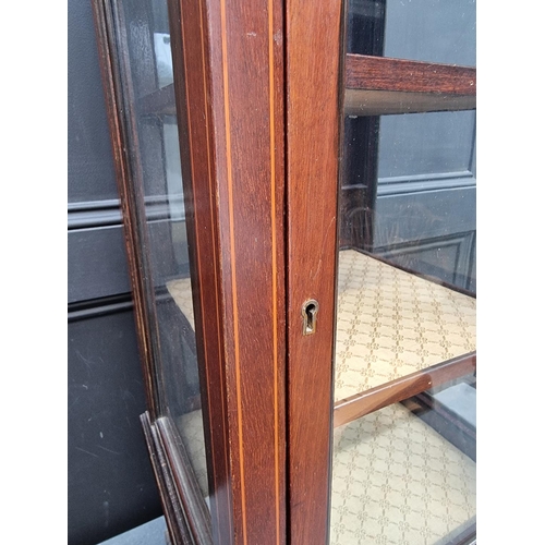 1098 - An unusually small Edwardian mahogany and line inlaid pillar display cabinet, 97cm high.... 