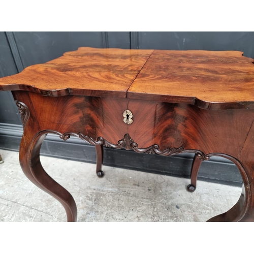 1099 - A 19th century Continental mahogany work table, with sliding top, 57cm wide.