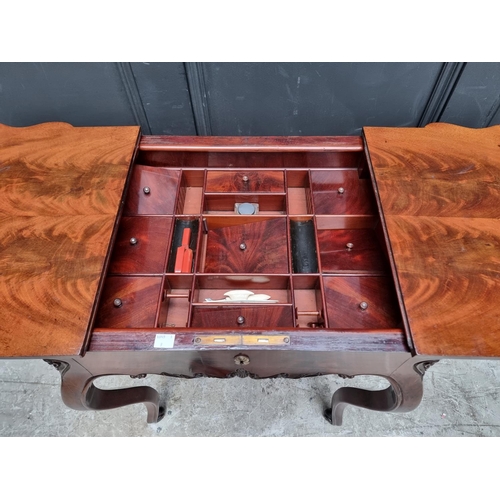 1099 - A 19th century Continental mahogany work table, with sliding top, 57cm wide.