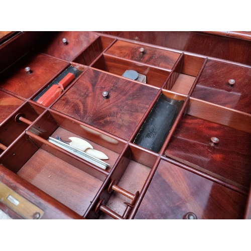 1099 - A 19th century Continental mahogany work table, with sliding top, 57cm wide.