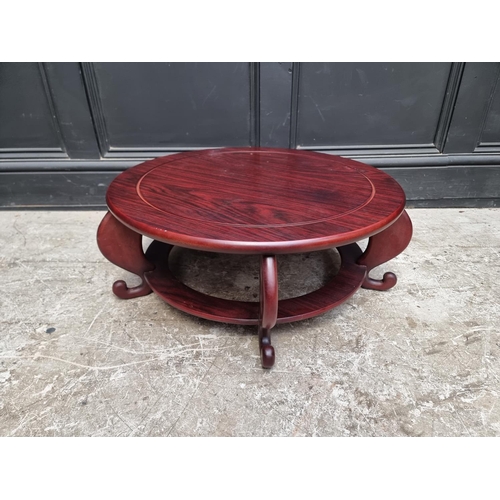 1104 - A modern Chinese hardwood low table, 60cm diameter.