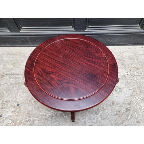 1104 - A modern Chinese hardwood low table, 60cm diameter.