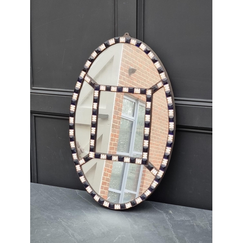 1115 - An Irish style oval wall mirror, 80 x 53cm. 