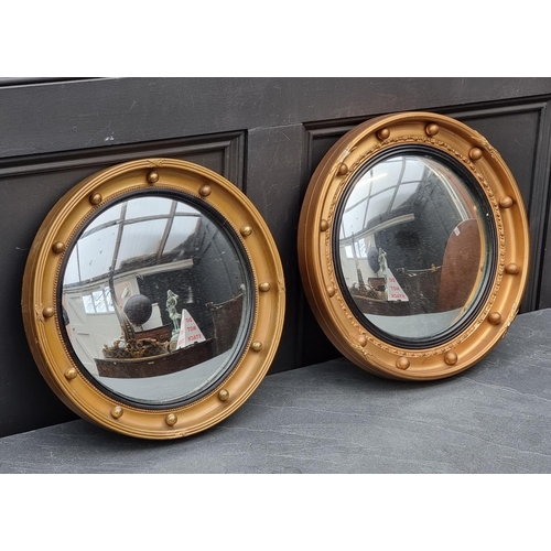 1118 - Two similar reproduction gilt framed convex wall mirrors, largest 41cm diameter; together with anoth... 