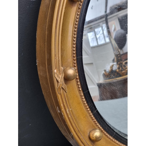 1118 - Two similar reproduction gilt framed convex wall mirrors, largest 41cm diameter; together with anoth... 