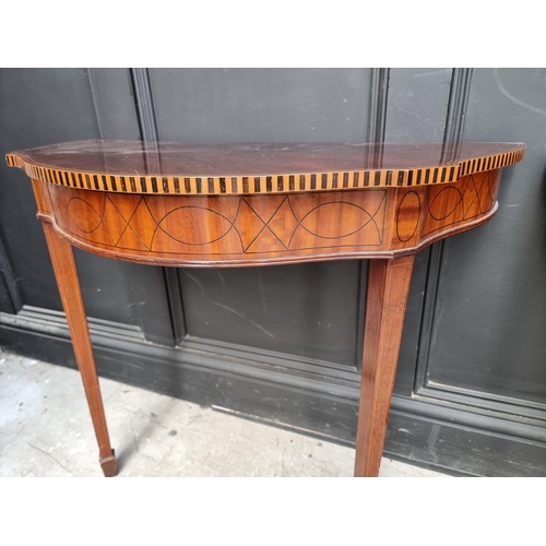 1123 - A pair of early 20th century mahogany and inlaid console tables, 80cm wide. 