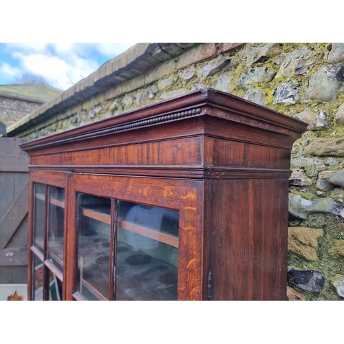 1124 - A George III oak and mahogany bookcase, 126.5cm wide; together with another George III chest of draw... 