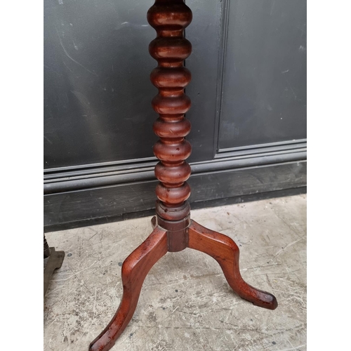 1130 - An Edwardian mahogany Sutherland table, 68.5cm wide; together with a Victorian mahogany tripod table... 