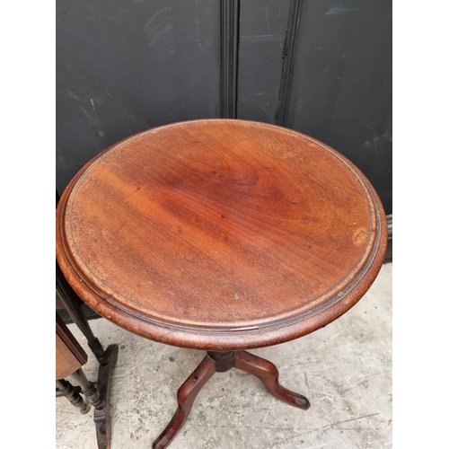 1130 - An Edwardian mahogany Sutherland table, 68.5cm wide; together with a Victorian mahogany tripod table... 