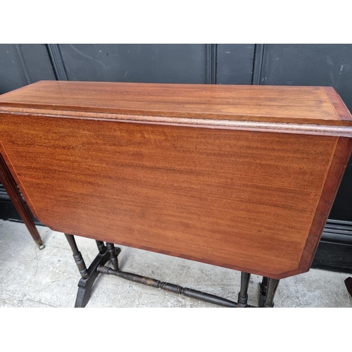 1130 - An Edwardian mahogany Sutherland table, 68.5cm wide; together with a Victorian mahogany tripod table... 