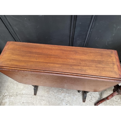 1130 - An Edwardian mahogany Sutherland table, 68.5cm wide; together with a Victorian mahogany tripod table... 