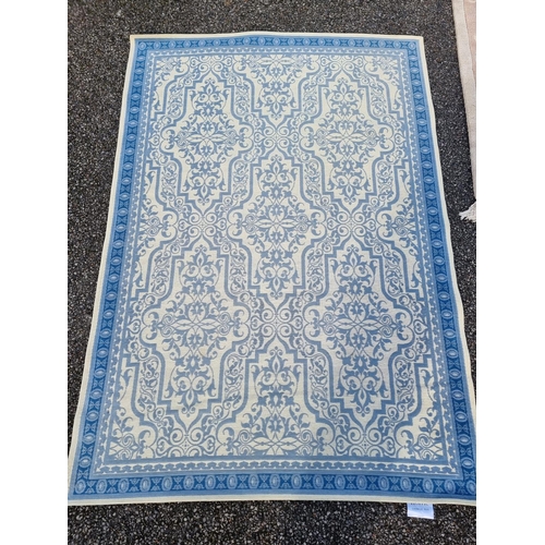 1132 - Two modern Chinese rugs; together with a modern Marks and Spencer's rug, largest, 210 x 138cm. (3)... 