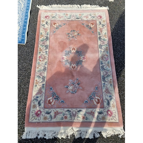 1132 - Two modern Chinese rugs; together with a modern Marks and Spencer's rug, largest, 210 x 138cm. (3)... 