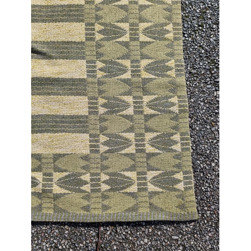 1135 - A Swedish double sided rug, 203 x 132cm.