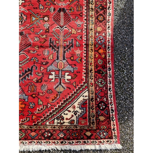 1138 - An Iranian rug, with tribal and geometric decoration to central field, 280 x 141cm.