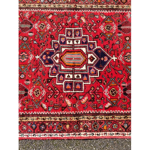 1138 - An Iranian rug, with tribal and geometric decoration to central field, 280 x 141cm.