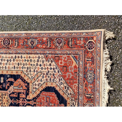 1144 - A Persian rug, having geometric cartouches to each corner, 210 x 140cm.