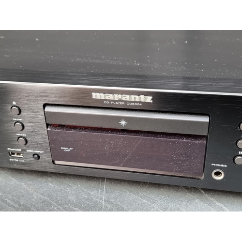 1153 - Hi-Fi Equipment: a Marantz CD6004 CD Player, boxed, with RC004CD remote, with power lead and related... 