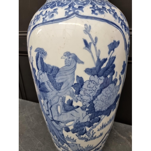 1169 - A large modern Chinese blue and white vase, 77cm high, on hardwood stand.