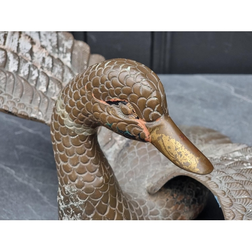 1182 - A cast brass duck, wingspan 57cm.