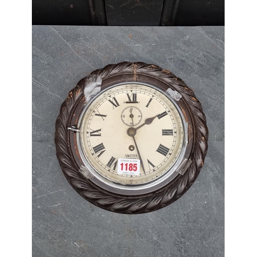 1185 - A Smiths ropetwist frame wall clock, 23.5cm diameter.