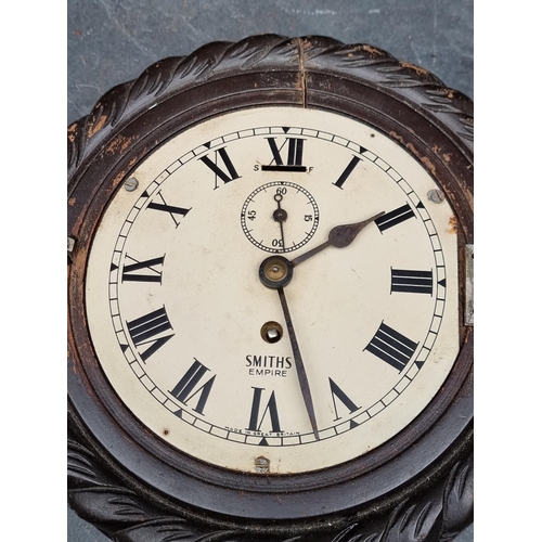 1185 - A Smiths ropetwist frame wall clock, 23.5cm diameter.