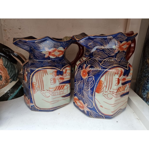 1193 - Four Royal Doulton character jugs; together with a graduated set of three reproduction hydra jugs. (... 