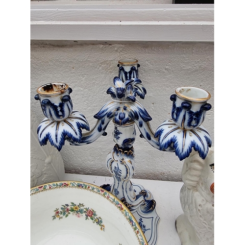 1195 - A Meissen three branch blue and white candelabrum, 29.5cm high; together with a pair of Staffordshir... 