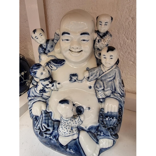 1198 - A mixed group of ceramics and works of art, to include a Chinese blue and white Buddha, 22.5cm ... 