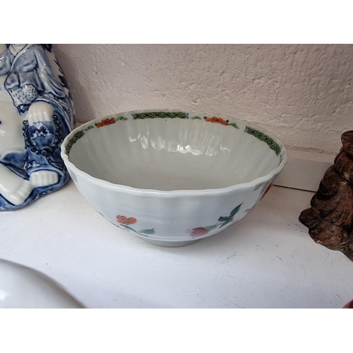 1198 - A mixed group of ceramics and works of art, to include a Chinese blue and white Buddha, 22.5cm ... 