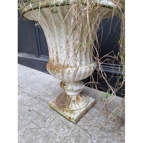 1210 - A pair of Victorian white painted cast iron urns, 48.5cm high. (2)