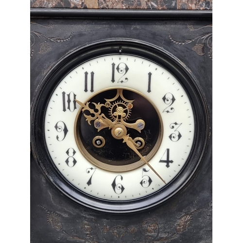 1223 - A late 19th century slate and marble mantel clock, 53cm high, with pendulum.