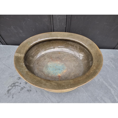 1225 - An antique brass jardiniere or wine cooler, 52.5cm wide.