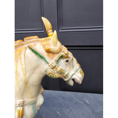 1227 - A large Chinese Tang style pottery horse, 54cm high.