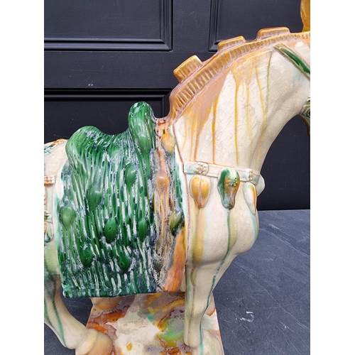 1227 - A large Chinese Tang style pottery horse, 54cm high.