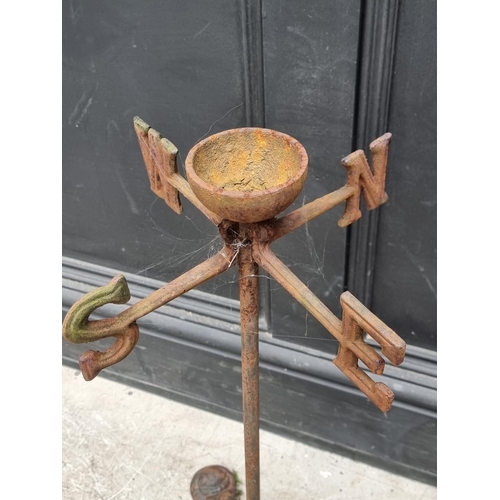 1233 - An unusual weathervane style stand, 60cm high.