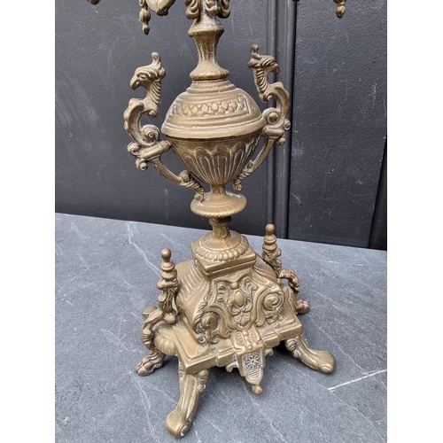 1240 - A brass four branched candelabrum; together with a pottery and brass table lamp. (2)... 