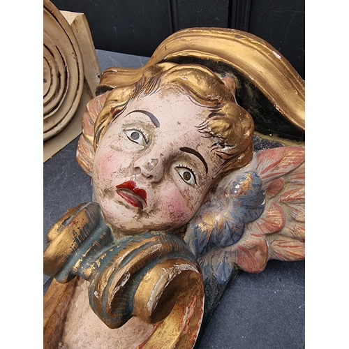 1241 - A carved wood and polychrome painted cherub wall bracket, 32cm high; together with another corbel br... 