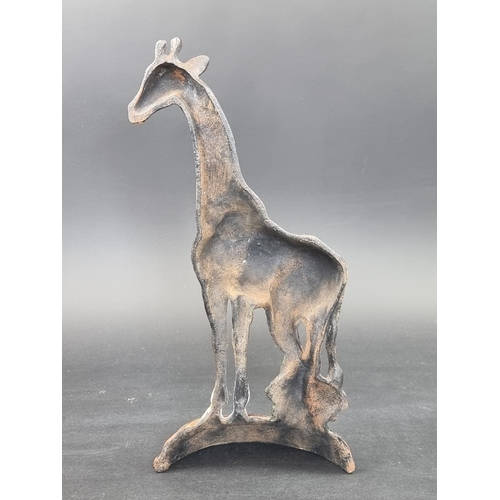 1242 - An unusual polychrome painted cast iron Giraffe door stop, 41.5cm high.