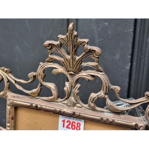 1268 - A cast brass easel back frame, 37cm high.